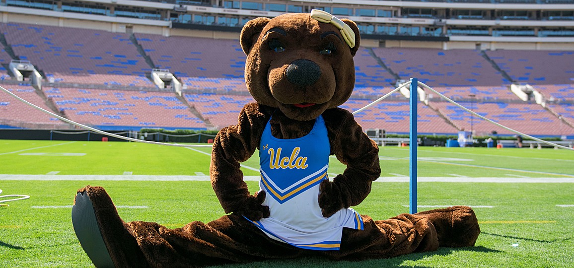 UCLA mascot, Josie Bruin, doing the splits on the field at the Rose Bowl