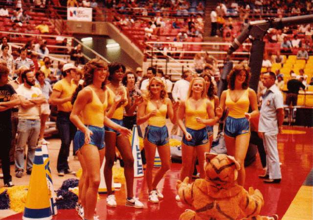 the 1979-80 Squad on the court before a basketball game