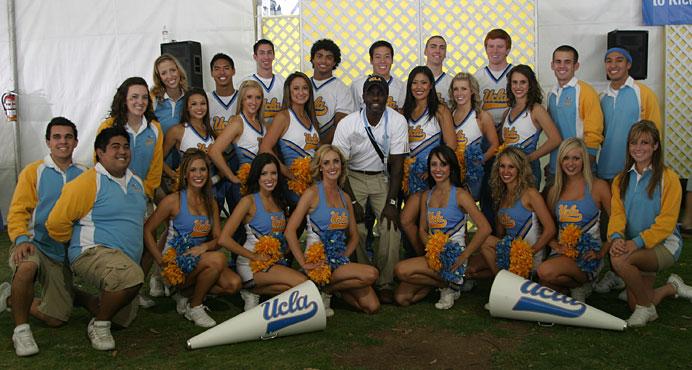 the 2008 Squad before a football game posing with Alumni Director Ralph Amos
