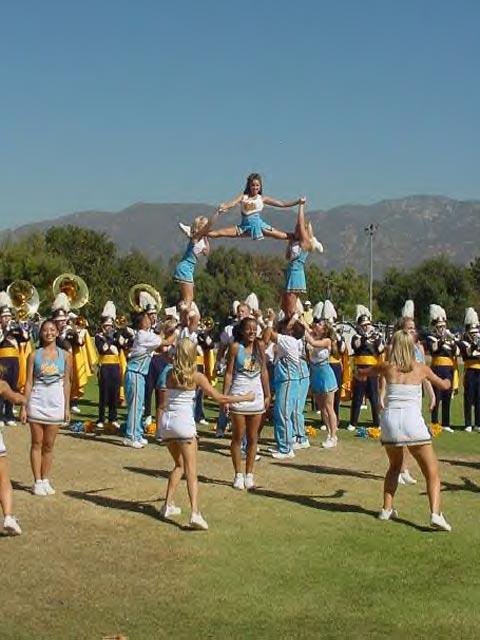 the 2001 Squad performing before a football game