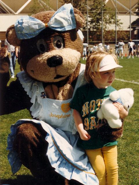 Josie Bruin and a young child before a game