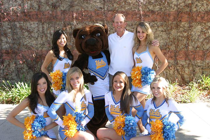 the 2009 Squad with former Head Football Coach Rick Neuheisel