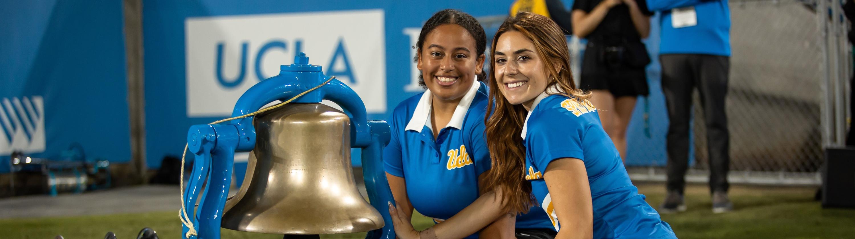 Members of the Squad with the Victory Bell