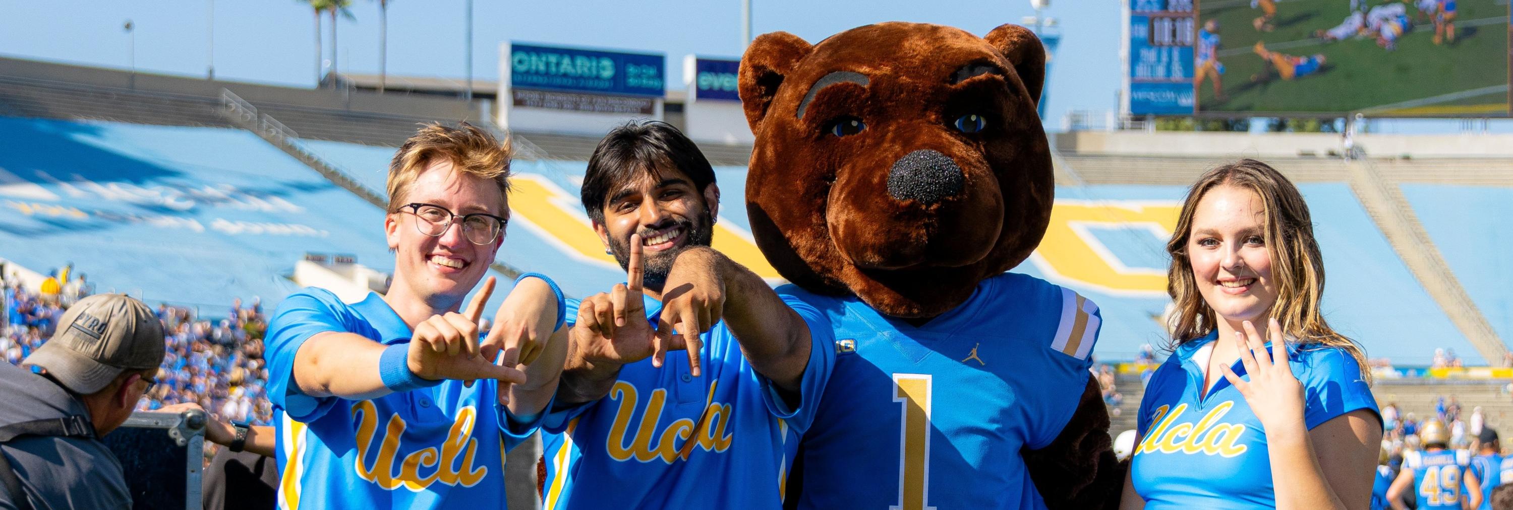 Members of the UCLA Spirit Squad with Joe Bruin on the field at the Rose Bowl
