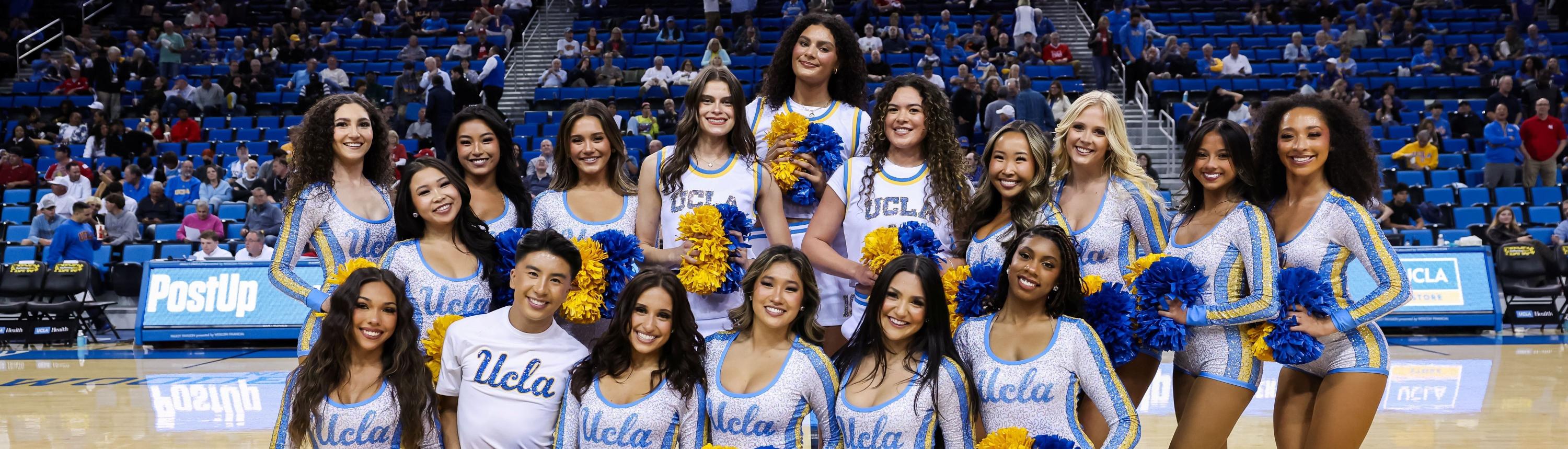 Members of the UCLA Dance Team and the WBB team at center court of Pauley Pavilion